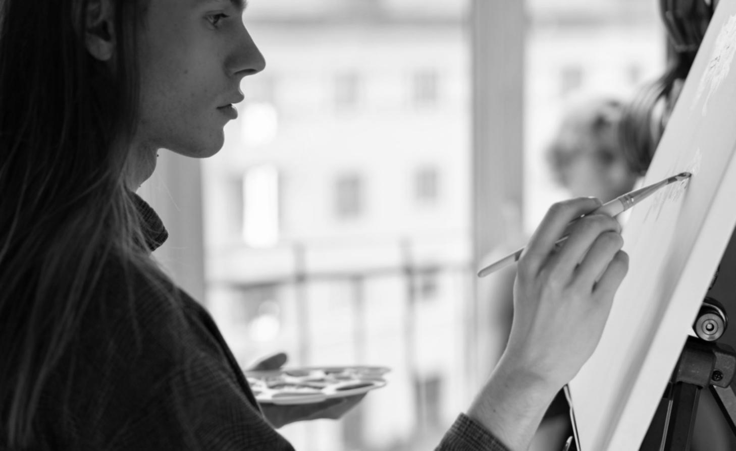 Watercolor painting workspace with brushes and color swatches