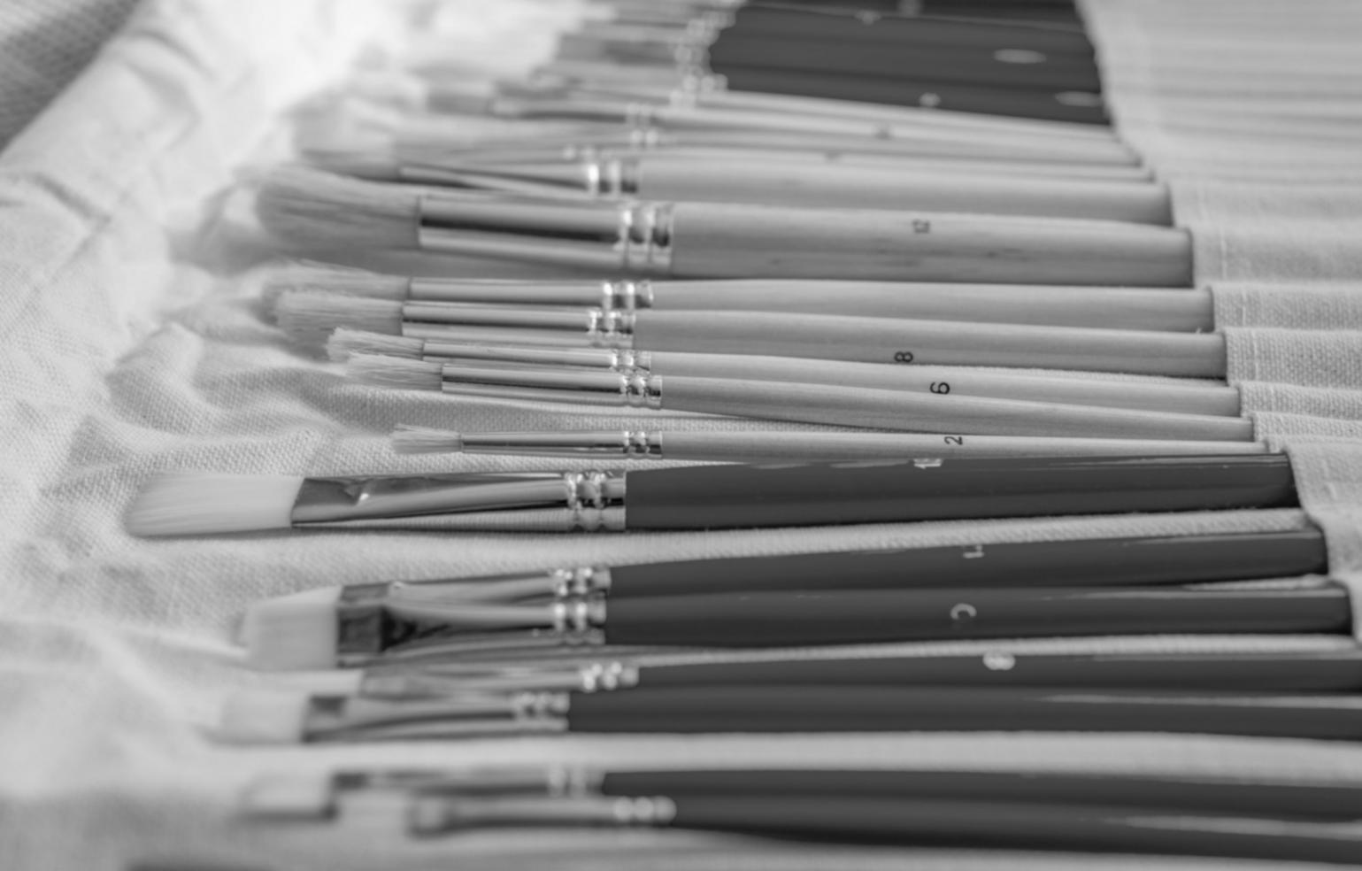 Student working on detailed watercolor illustration techniques